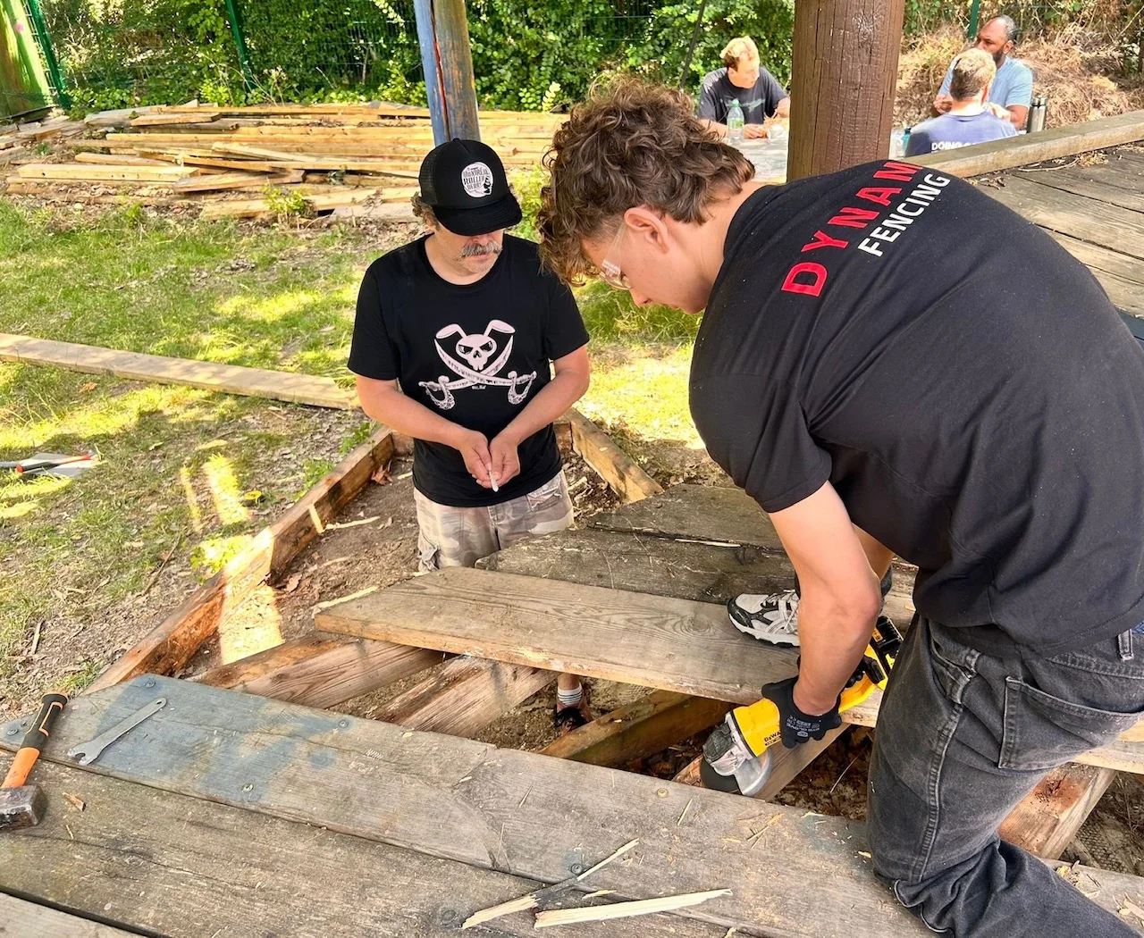 Practical timber work on an outdoor play structure at London Play Design.